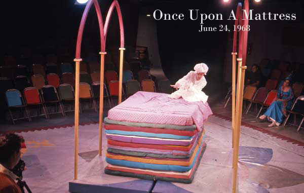 The princess climbs into bed in a production of Once Upon a Mattress.