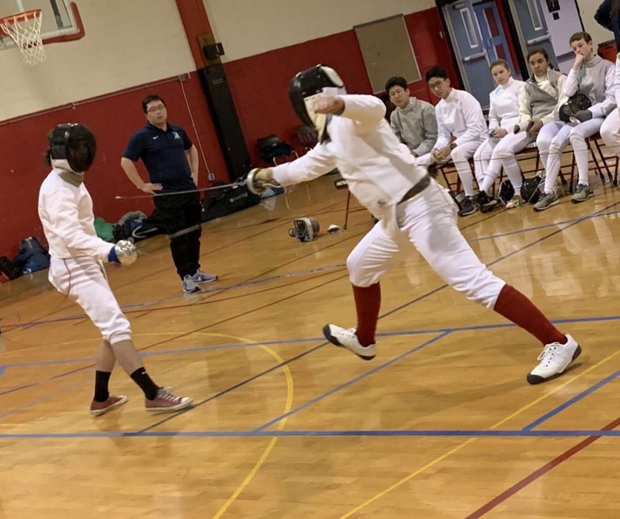 An+Archbishop+Carroll+fencing+team+member+goes+after+an+opponent+during+a+match+last+year.
