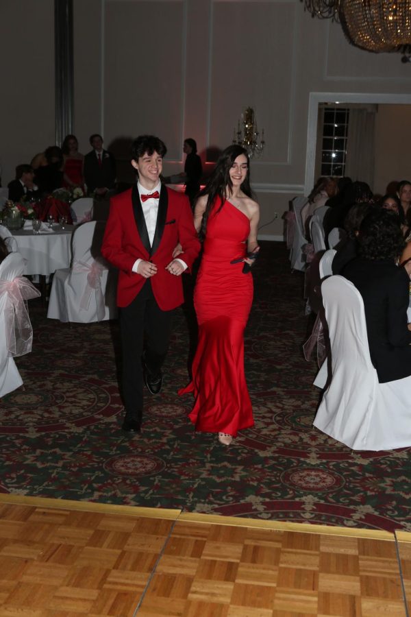 Ashley Palmer and her date, Nate Lechtenberg, look dashing in red at senior prom.