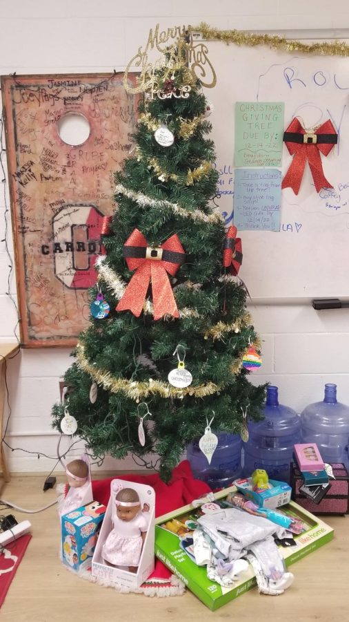 The giving tree in the campus ministry office already has presents beneath it, but more are needed.