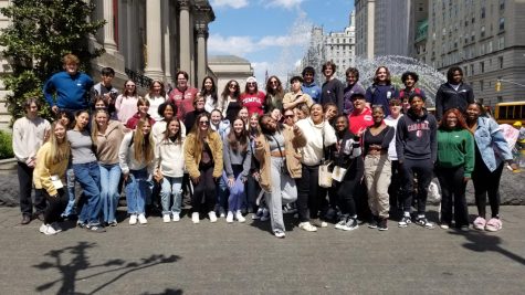 Members of the Class of 2023 gather with Mr. Valenti, the senior theology teacher, outside the Metropolitan Museum of Art in New York City during a field trip Mr. Valenti organized for April 24.