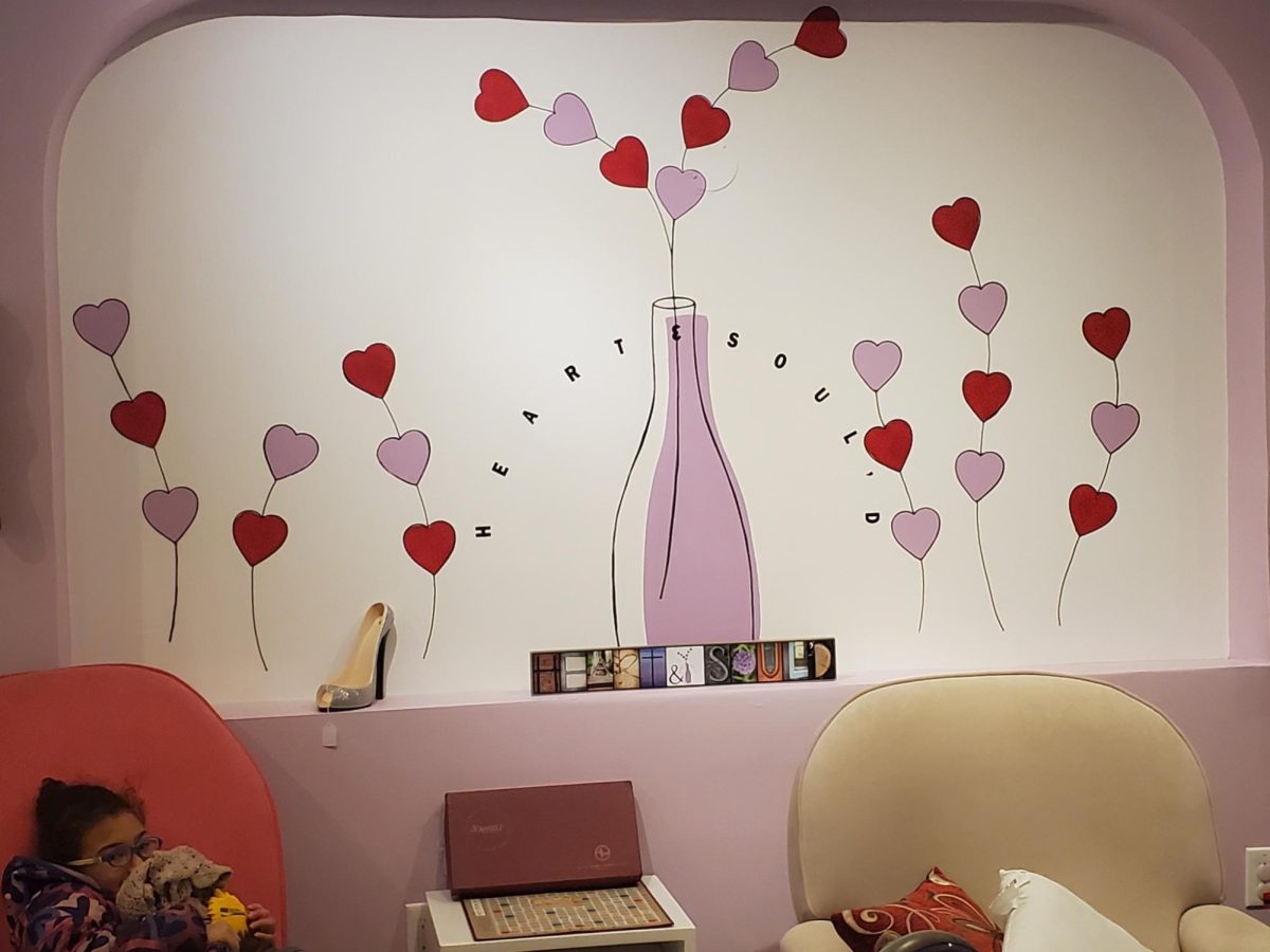 Hearts dot the wall at Heart and Sould, a new Swarthmore thrift shop run by Mrs. Terri Crossan to raise money for organizations that work with foster families and adoptive families.