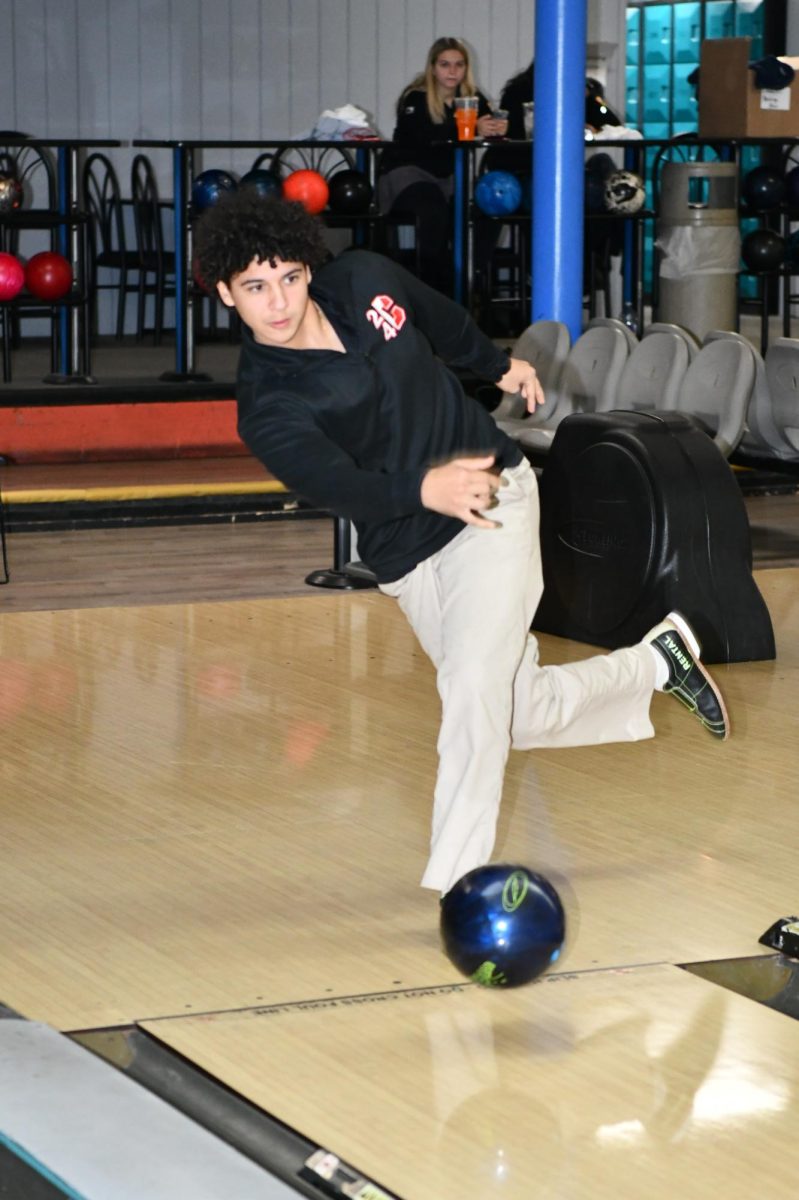 Senior Marco Petroccia bowls a strike on his way to a score of 255.