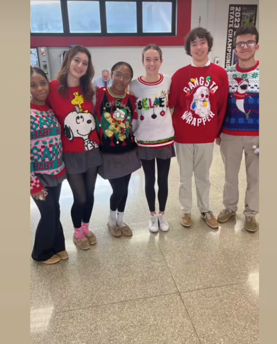 Students participate in a half dress down day before Christmas. Students wear the bottom half of their uniforms and an ugly Christmas sweater on top.