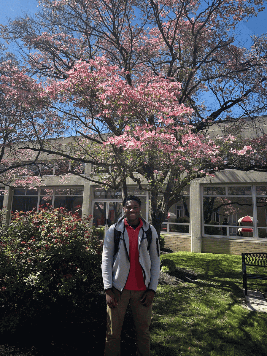 Senior Tyhir Phillips enjoys the spring sun in his spring uniform.