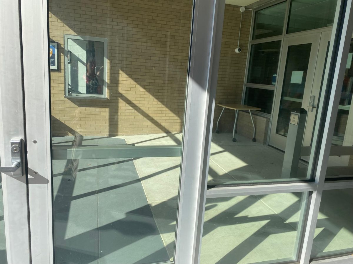 The new glass-enclosed entrance at Archbishop Carroll has two ID-activated locks for safety. Users must activate the first lock with an ID. If they don't have one, they have to get buzzed in by an employee, show ID, and get a visitor pass. After that, users have to activate the second lock -- or get buzzed in -- to enter the school.