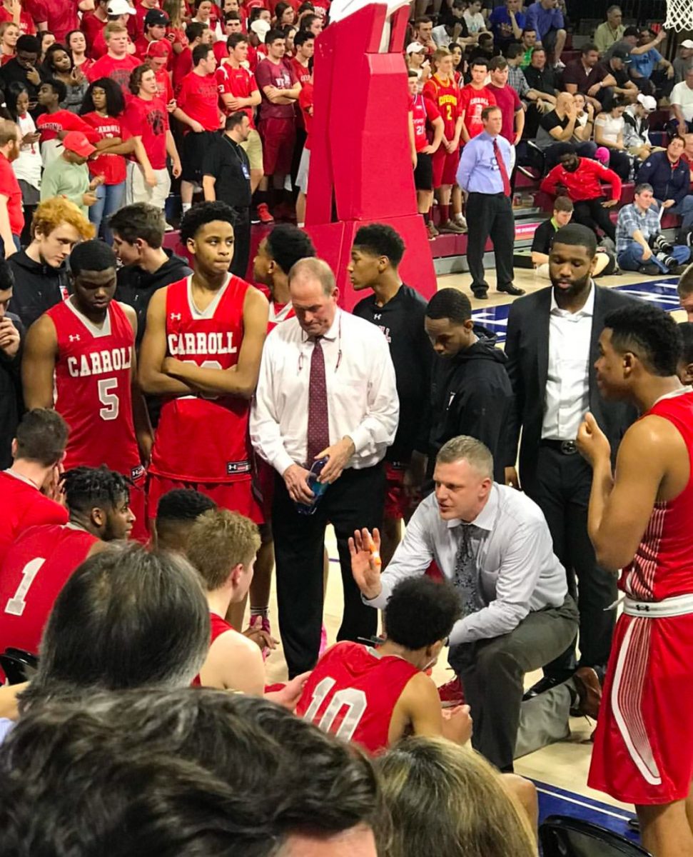 A basketball standout at Archbishop Carroll in the 1970s, Mr. Fran Lynam (center, wearing a red necktie) came back to his alma mater in 2014 to be an assistant basketball coach and a guidance counselor.