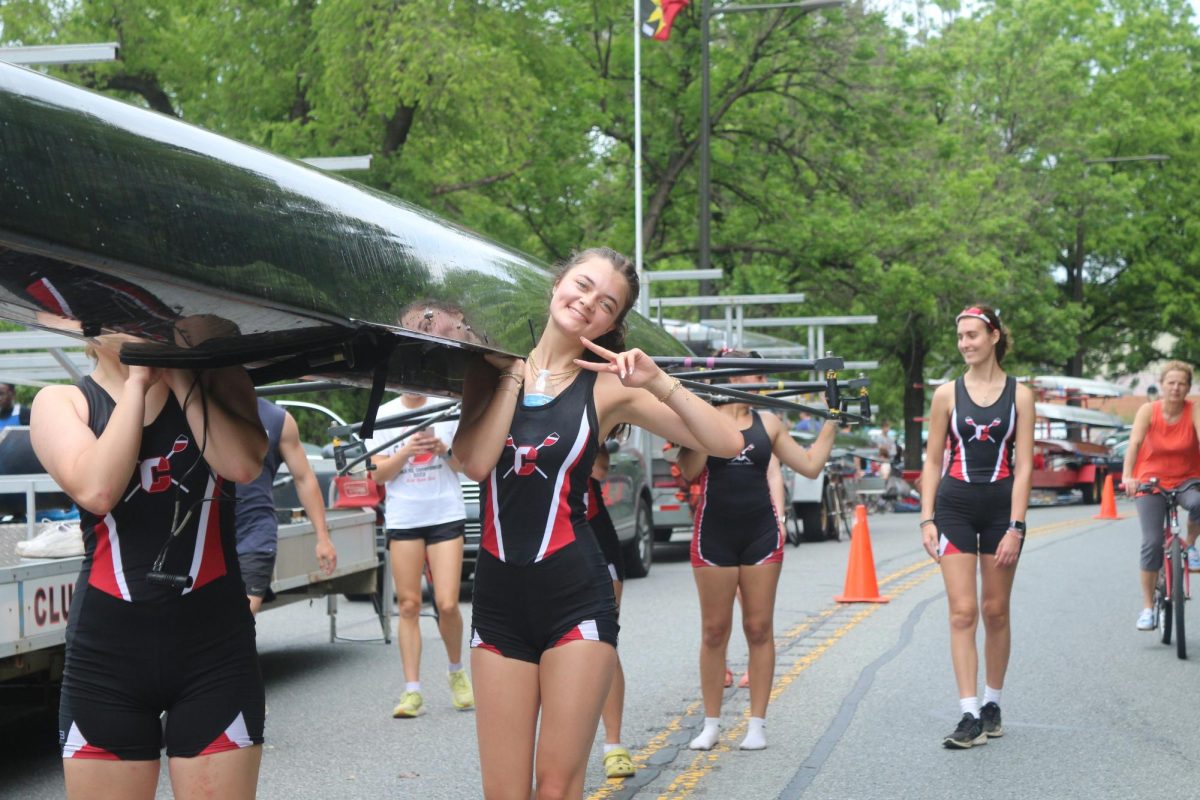 A rower from Archbishop Carroll crew's junior varsity four team smiles after the team qualifies for the City Championship semifinals.
