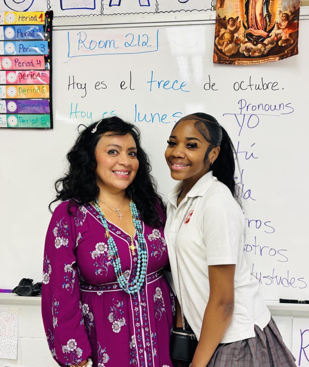 Spanish teacher Mrs. Alicia Flores and senior Makayla Miles share a moment in Mrs. Flores’s classroom