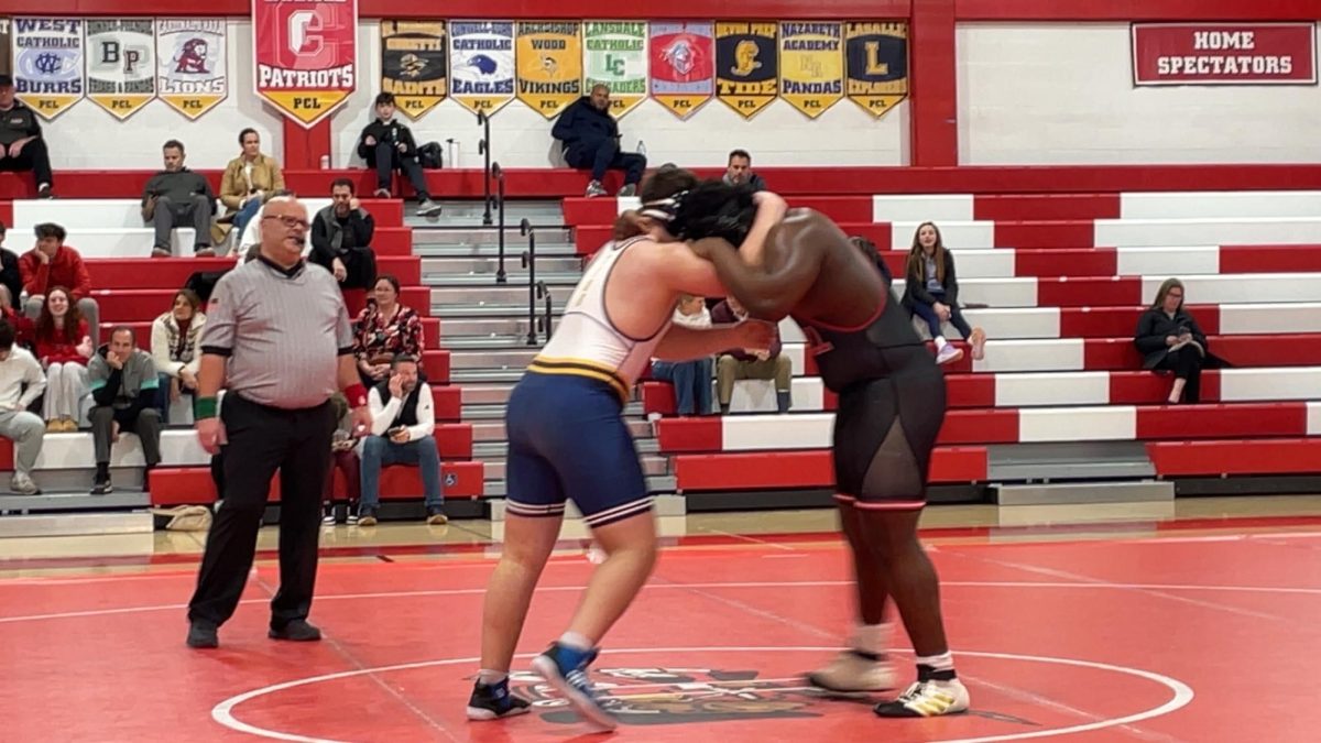 Shane Allison grapples with his opponent in the beginning of his match.